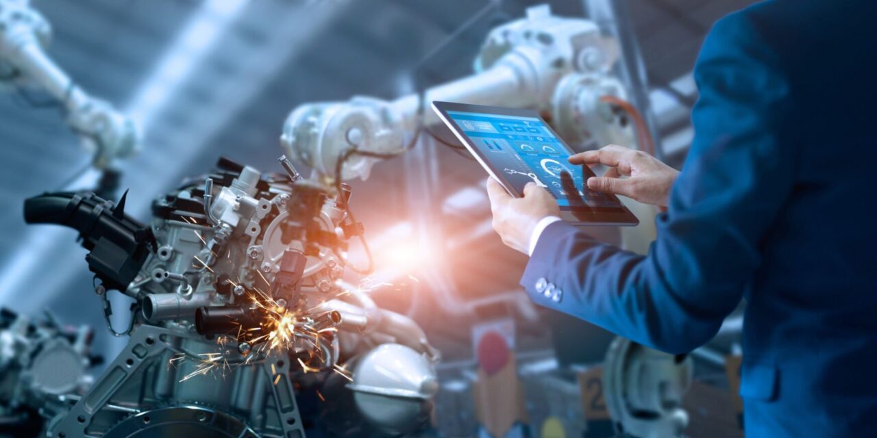 Engineer manager check and control automation robot arms machine in intelligent industrial factory on real time monitoring system software. Welding robotics and digital manufacturing operation. Manager engineer check and control automation robot arms machine in intelligent factory industrial on real time monitoring system software. Welding robotics and digital manufacturing operation.